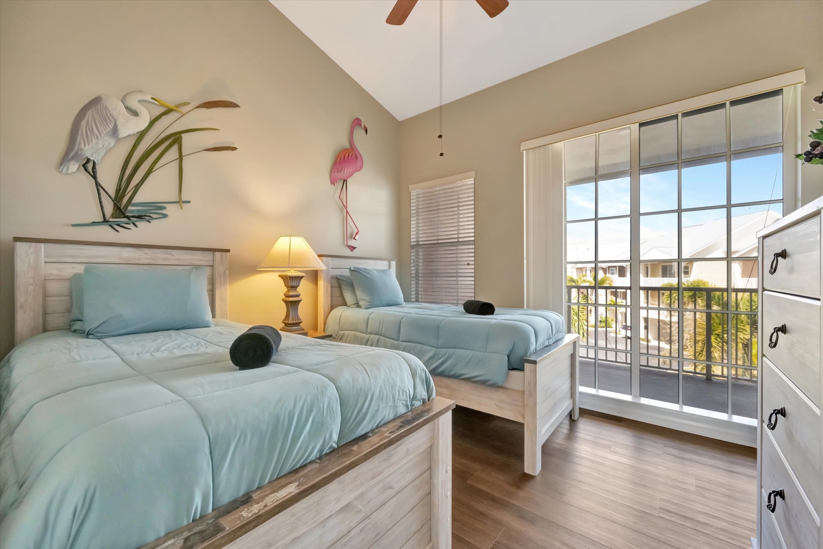 Relax in your coastal retreat with twin beds dressed in soothing aqua, where vaulted ceilings and a ceiling fan keep you comfortable. Step out to your private balcony and soak in the Florida sunshine.