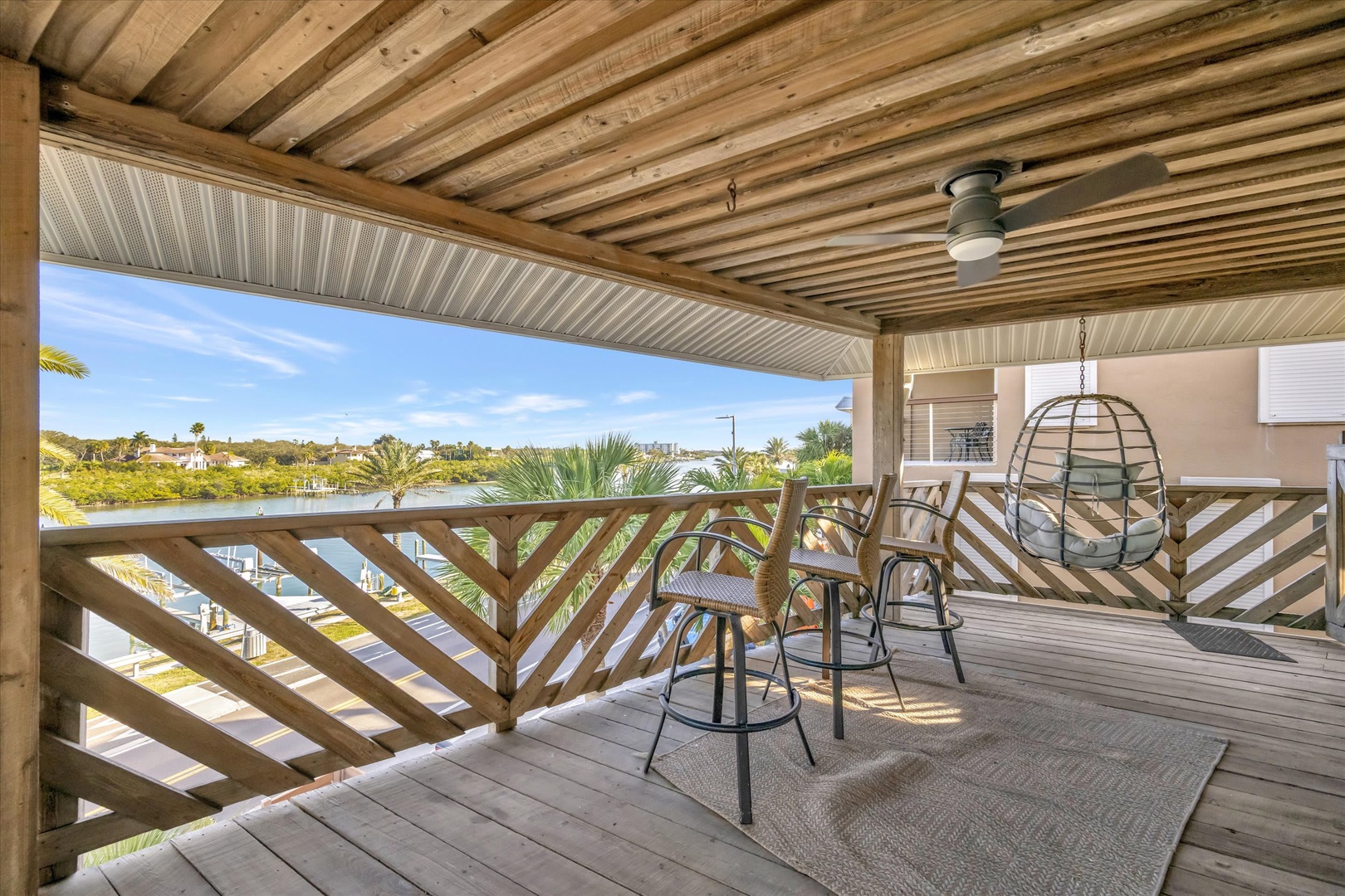 Sip your morning coffee from your private covered deck, where waterfront views and coastal breezes create the perfect escape. Shaded seating invites you to unwind and soak in the peaceful scenery.