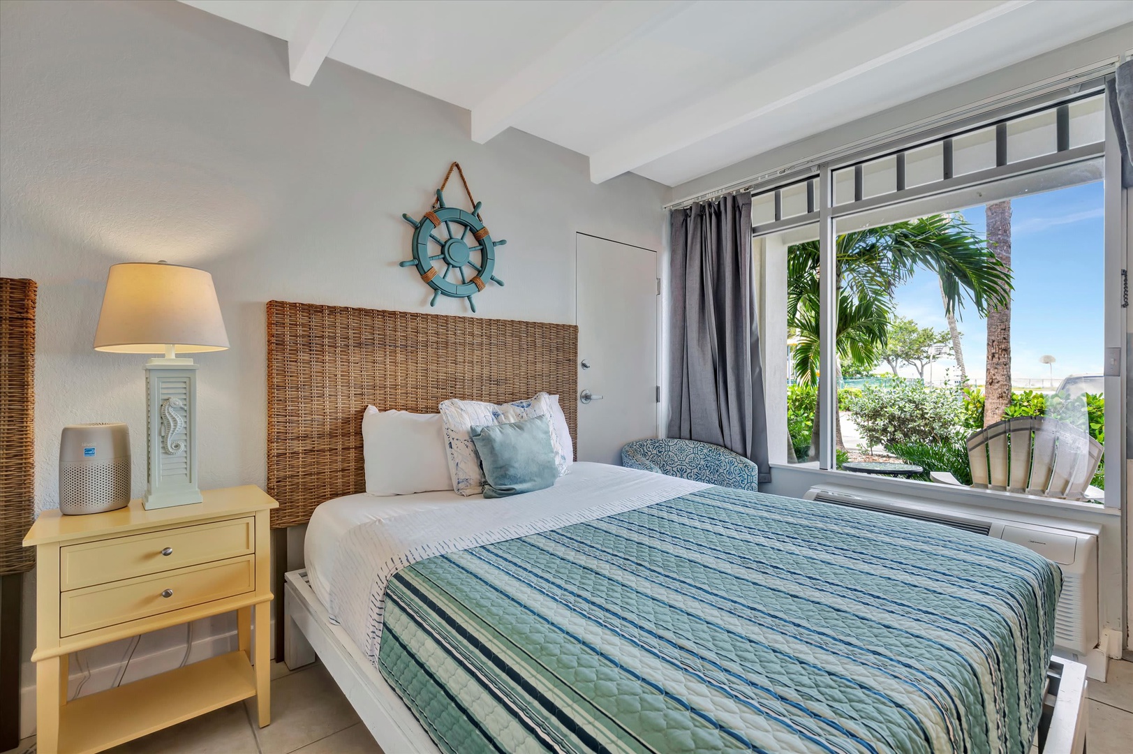 Drift off in your coastal-inspired bedroom, where woven textures and soothing blues set a tranquil tone. Beyond your window, swaying palms and sunshine invite you to step right into paradise.