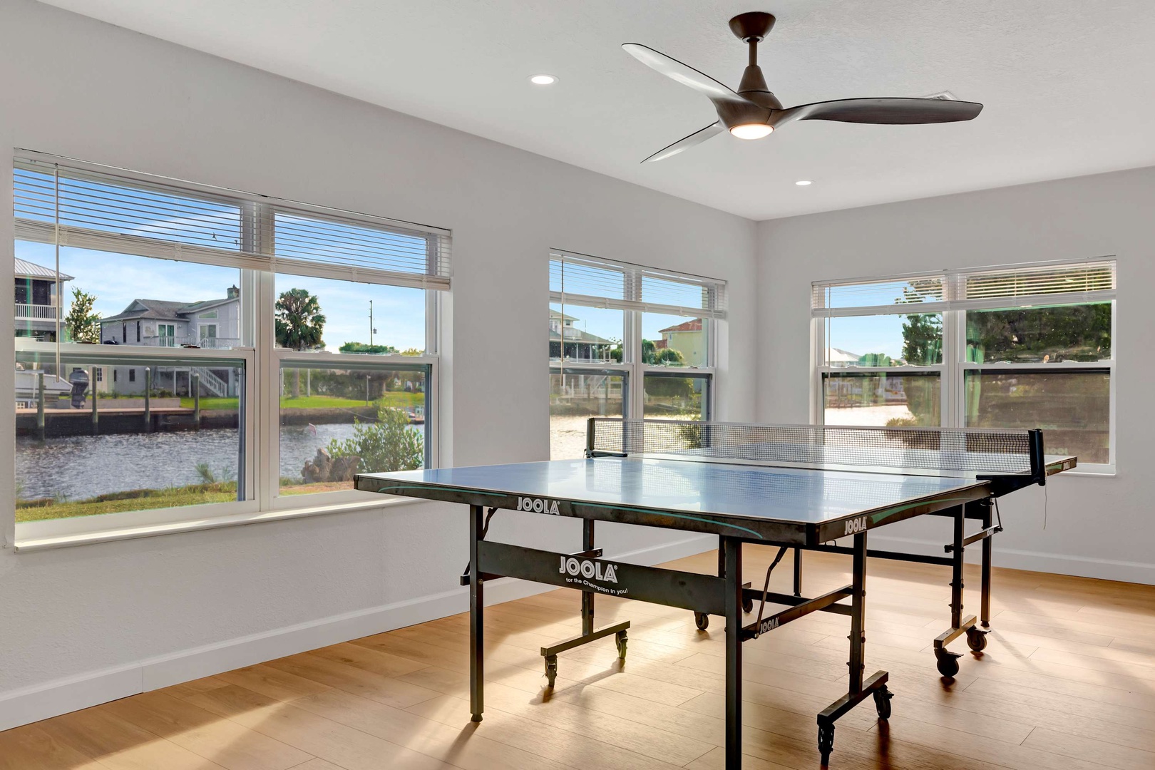 Challenge friends to a match in your bright game room, where waterfront views and a ceiling fan keep the atmosphere fresh and inviting.