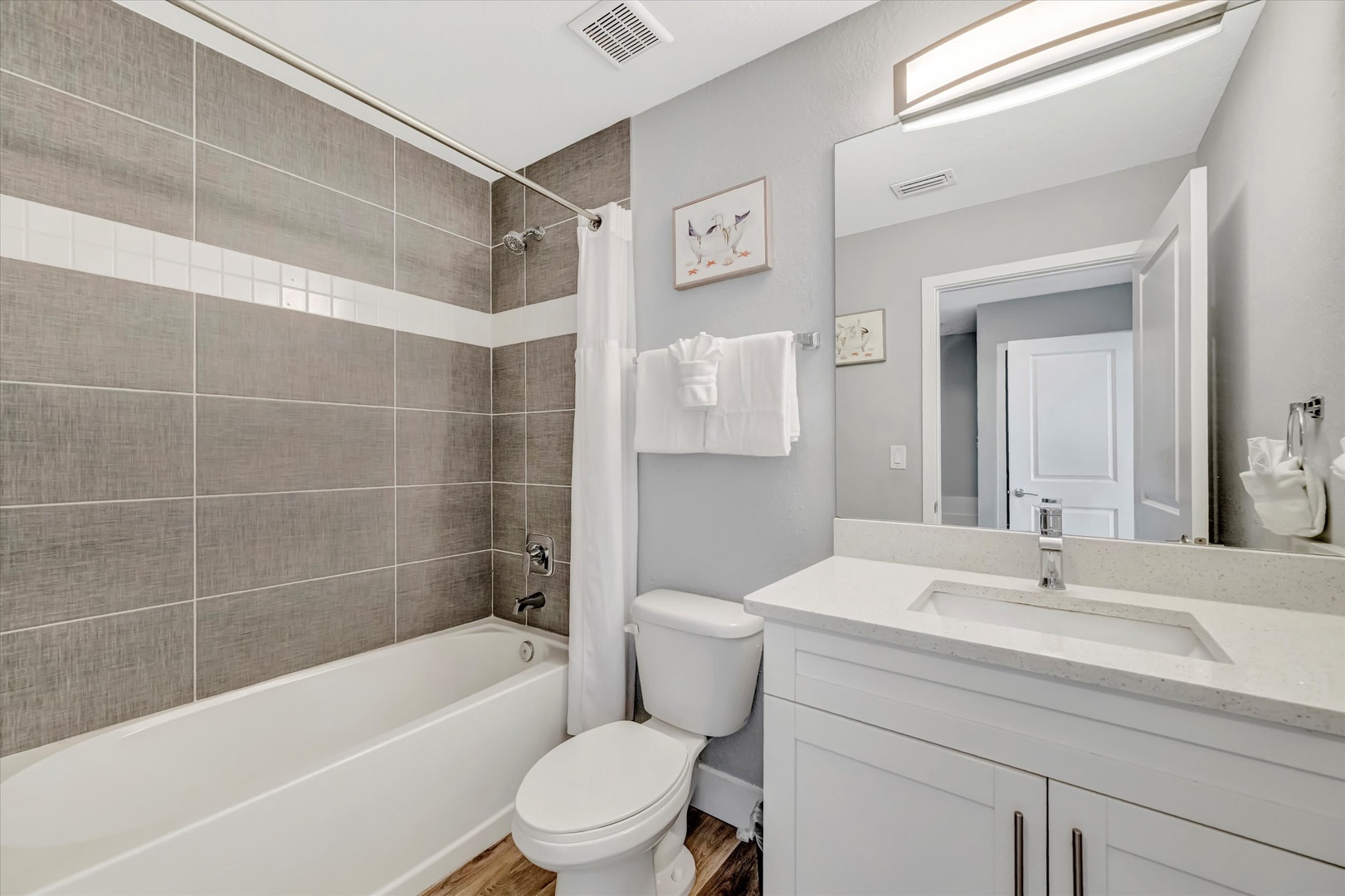 Step into your freshly updated bathroom—modern fixtures, neutral tones, and a soothing palette create the perfect space to unwind after a day of exploring.
