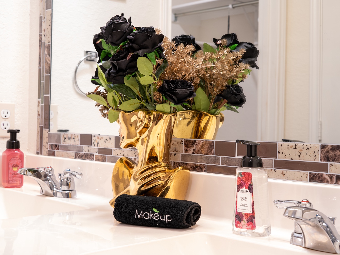 A thoughtfully styled bathroom awaits, complete with decorative touches and fresh amenities. Each detail, from the elegant fixtures to the welcoming accessories, is designed to make you feel right at home.