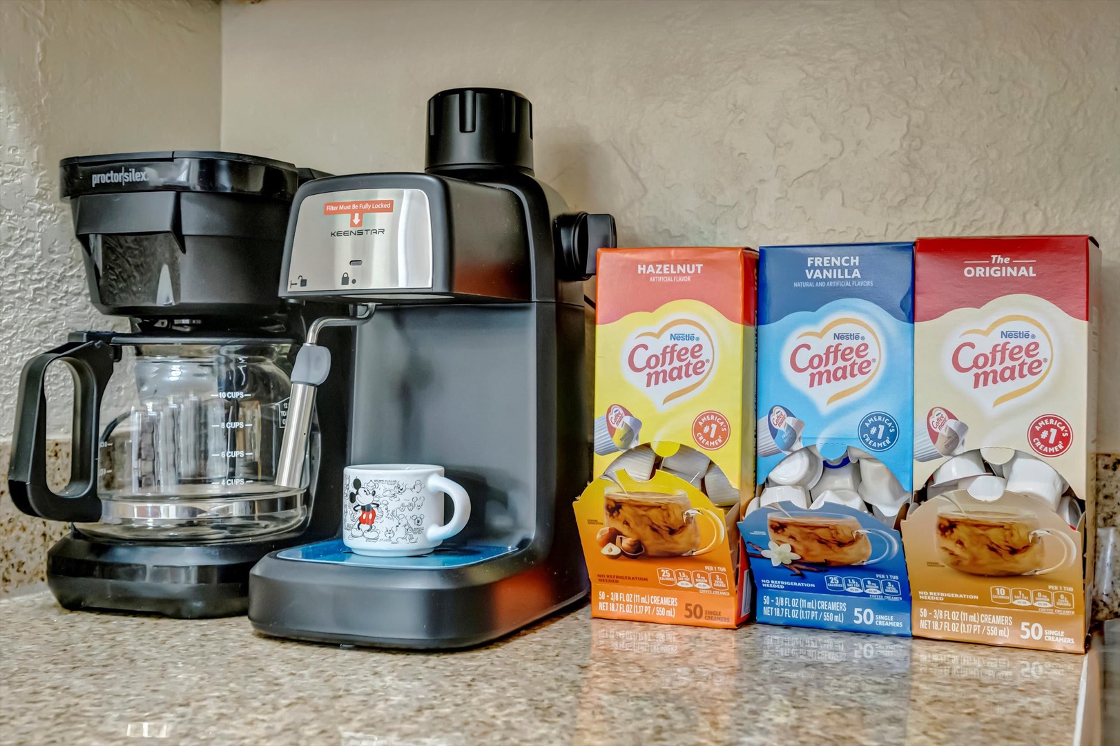 Start your mornings right with a fresh cup of coffee from your fully stocked coffee station, complete with a quality coffee maker and a variety of creamers to suit your taste.