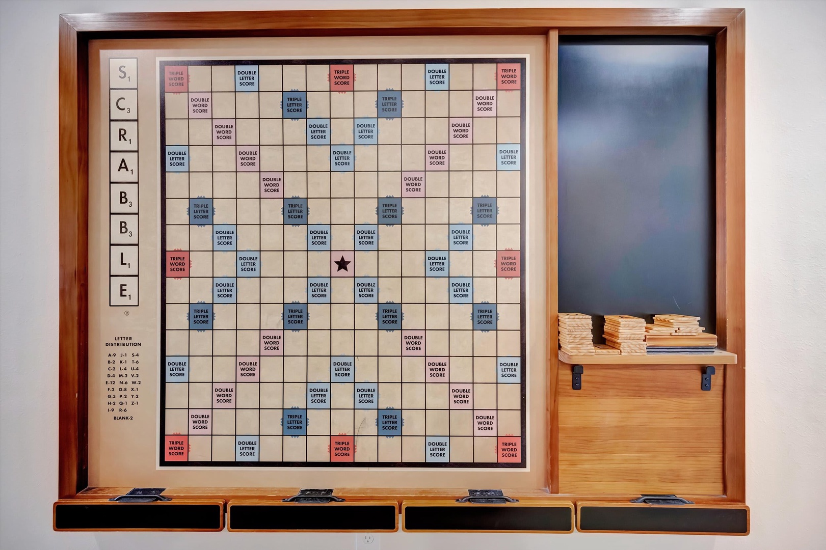 Challenge your travel companions to a friendly game on this wall-mounted Scrabble board—perfectly sized for family fun and rainy afternoons indoors.