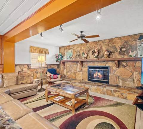 Sink into plush sofas beside a rustic stone fireplace, perfect for your après-ski evenings. Vaulted ceilings and southwestern character give you a warm, inviting retreat after exploring the slopes.