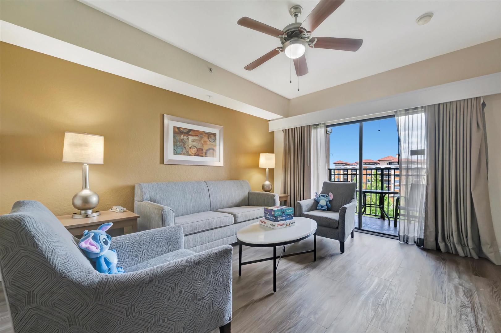 Relax in your comfortable living space with plush seating and charming balcony access that lets you step outside whenever you please.