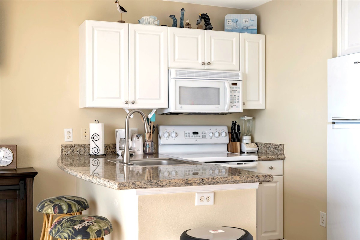 Your well-equipped kitchen features granite countertops, modern appliances, and everything you need to prepare meals during your stay. The bright, open layout makes cooking a breeze.