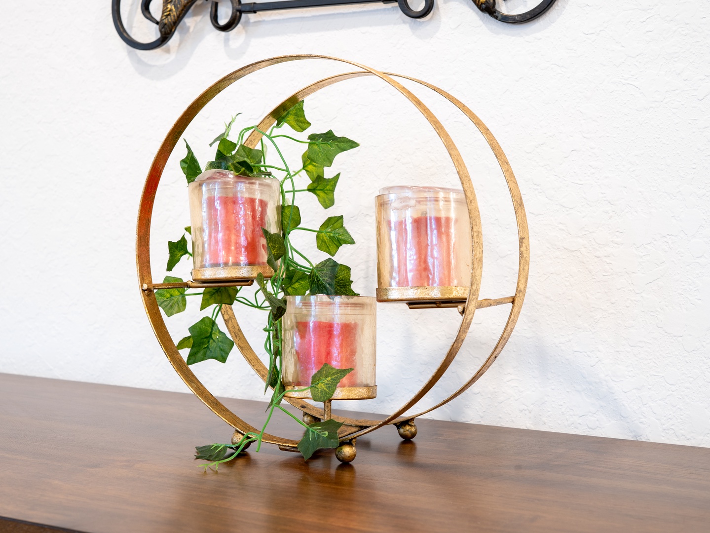 Charming décor piece with candles and trailing ivy adds a cozy, inviting touch to your space.