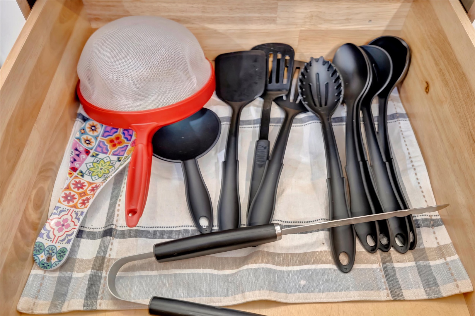 Your kitchen drawer is fully stocked with all the cooking tools you'll need, from ladles to spatulas, so you can whip up your favorite meals with ease.