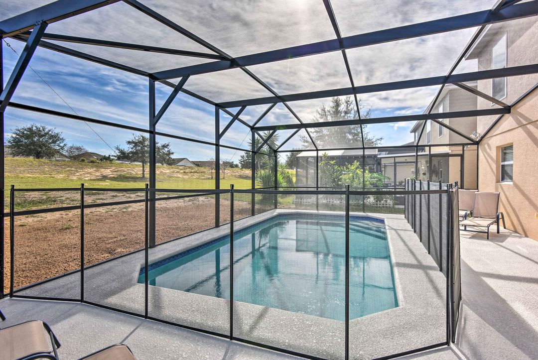 Dive into your private screened pool with sweeping views of natural Florida landscape—perfect for sun-soaked mornings and peaceful afternoons in your own protected oasis.