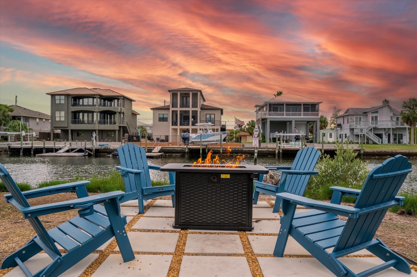 Gather around the crackling fire pit with waterfront views as the sky blazes with vibrant sunset hues. Perfect for evening conversations and s'mores under the stars.