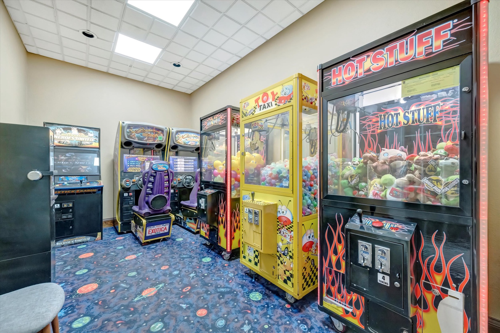 Step into your own arcade paradise, where classic claw machines, racing games, and colorful prizes await your playful side under bright skylights.