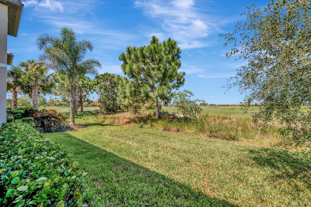 The property offers expansive natural surroundings with mature palms and lush greenery, providing a peaceful and private outdoor space for a relaxing getaway.