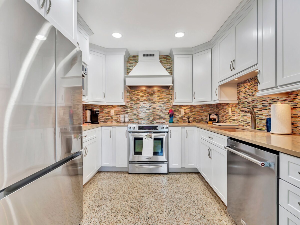 Step into your fully equipped kitchen with modern appliances and stunning backsplash. Bright, clean, and ready for you to whip up anything from morning coffee to a gourmet dinner.