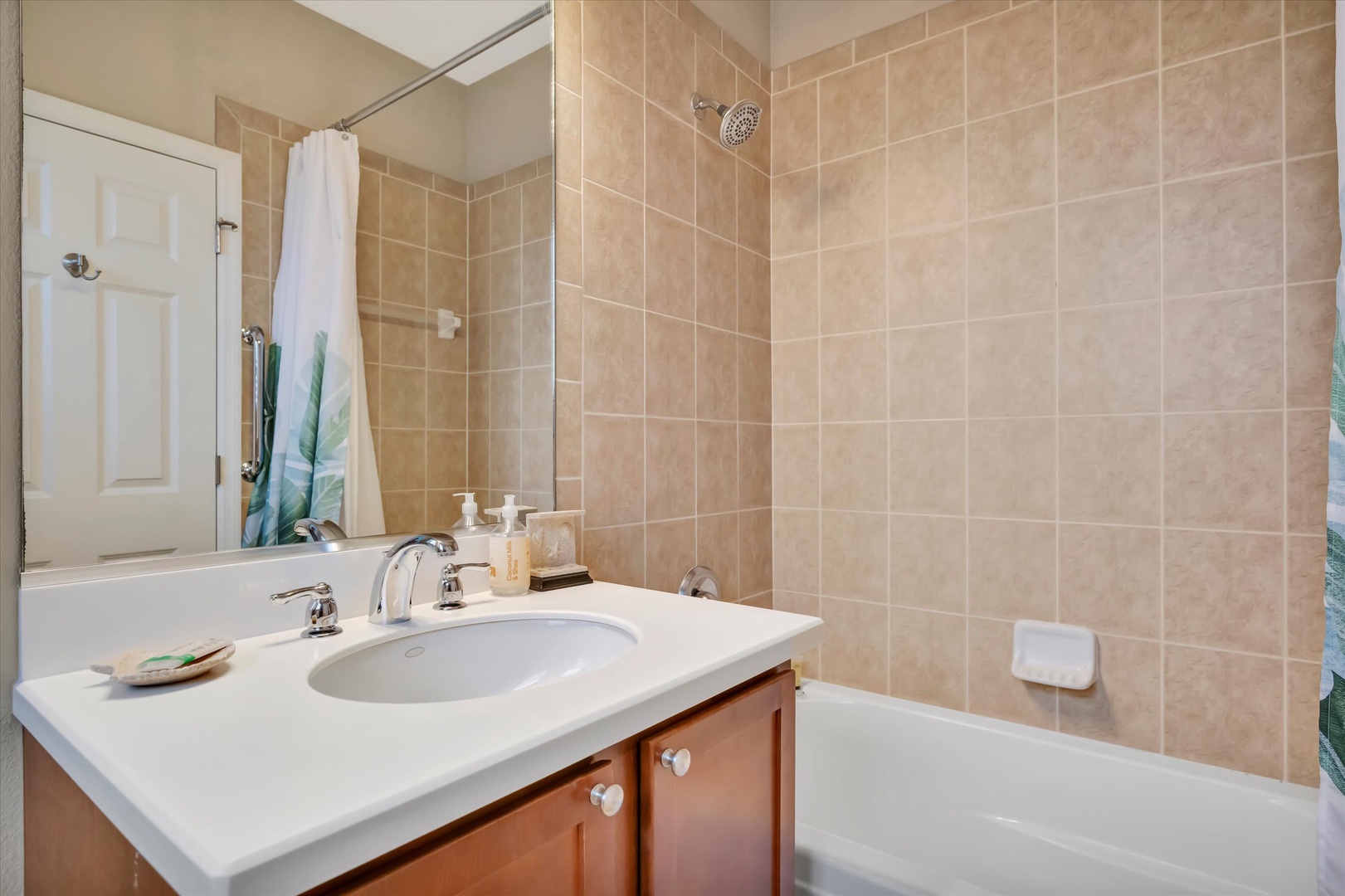 Freshen up in your private bathroom with a relaxing shower or bath. Warm tile, soft lighting, and thoughtful amenities make this space feel like home.