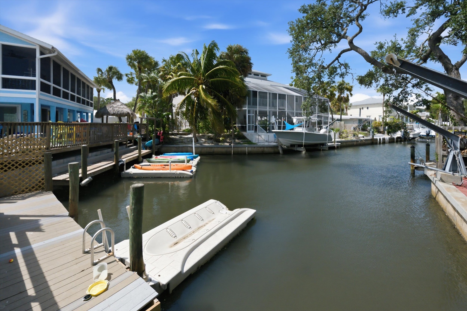 This waterfront property offers direct canal access with a private dock ready for kayaking adventures. Lush tropical landscaping and serene water views create the perfect Florida getaway setting.