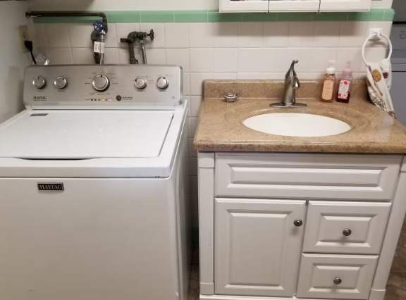 Your private laundry area includes a full-size washer and convenient vanity sink, making it easy to freshen up between adventures and feel right at home.