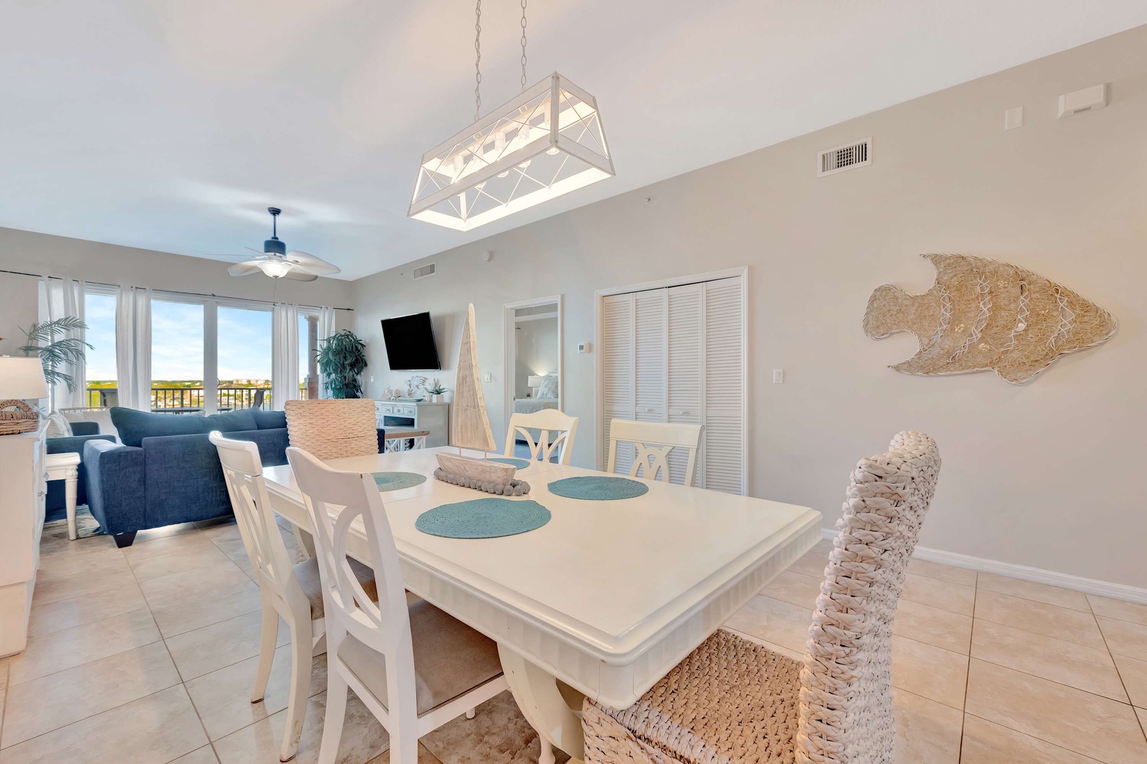 Light-filled dining and living space where you can gather over meals and enjoy the coastal-inspired décor and natural ambiance throughout your stay.