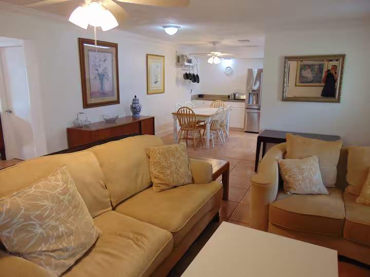 Relax in your open-concept living and dining space, where comfortable seating flows into a welcoming dining area and fully equipped kitchen—perfect for unwinding or gathering with loved ones.
