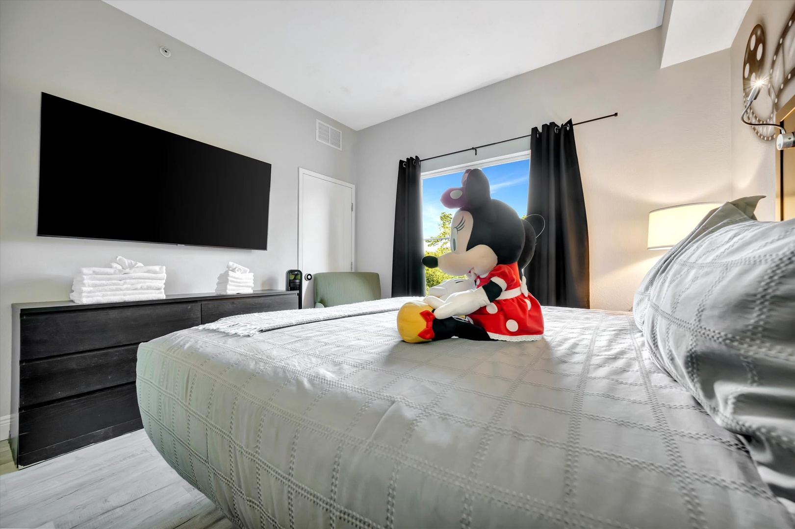 Your cheerful bedroom features crisp linens, a smart TV, and plenty of natural light to brighten your mornings.
