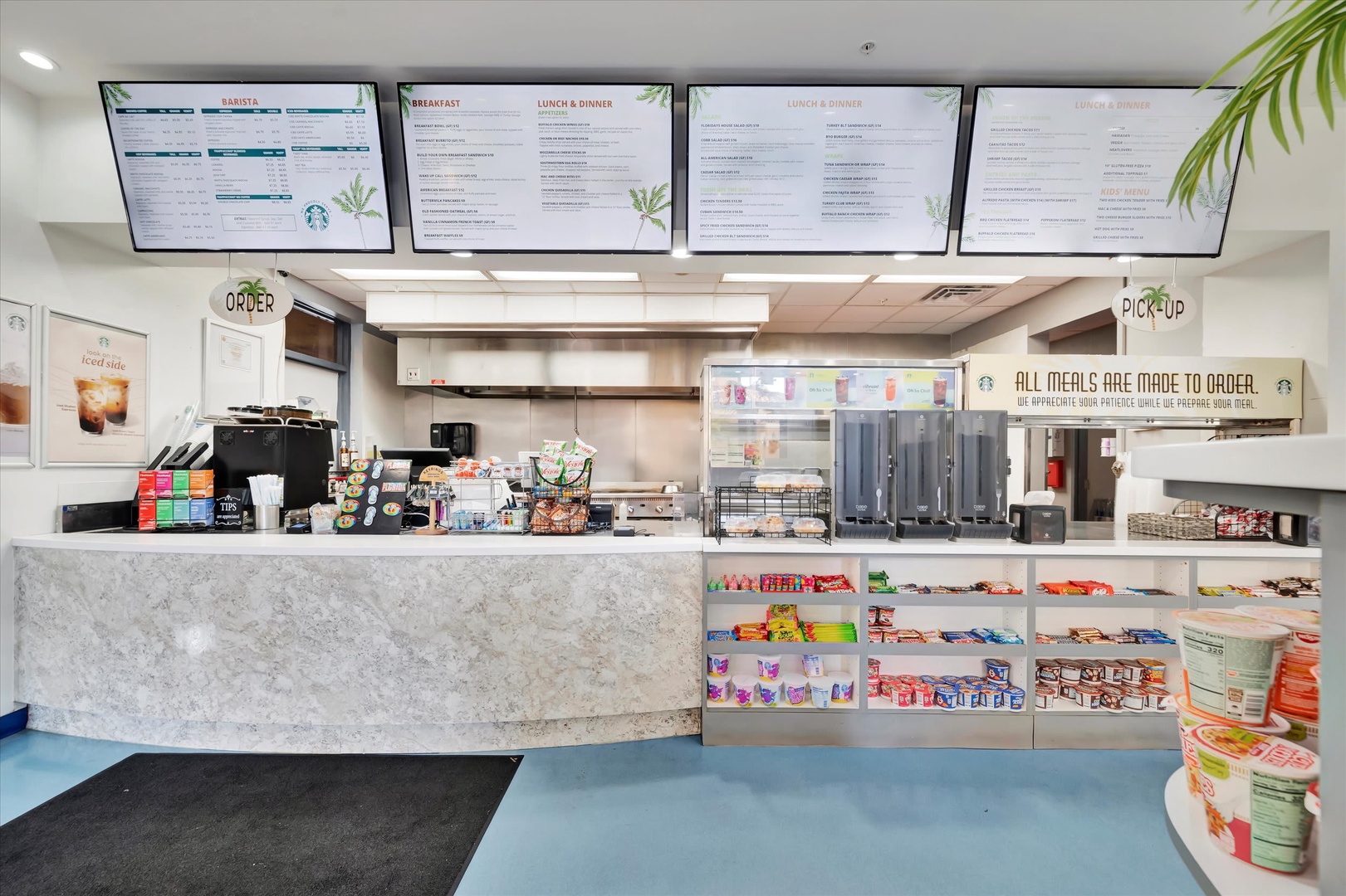 A bright, well-stocked café counter offering Starbucks coffee and quick grab-and-go snacks whenever you need a pick-me-up during your stay.