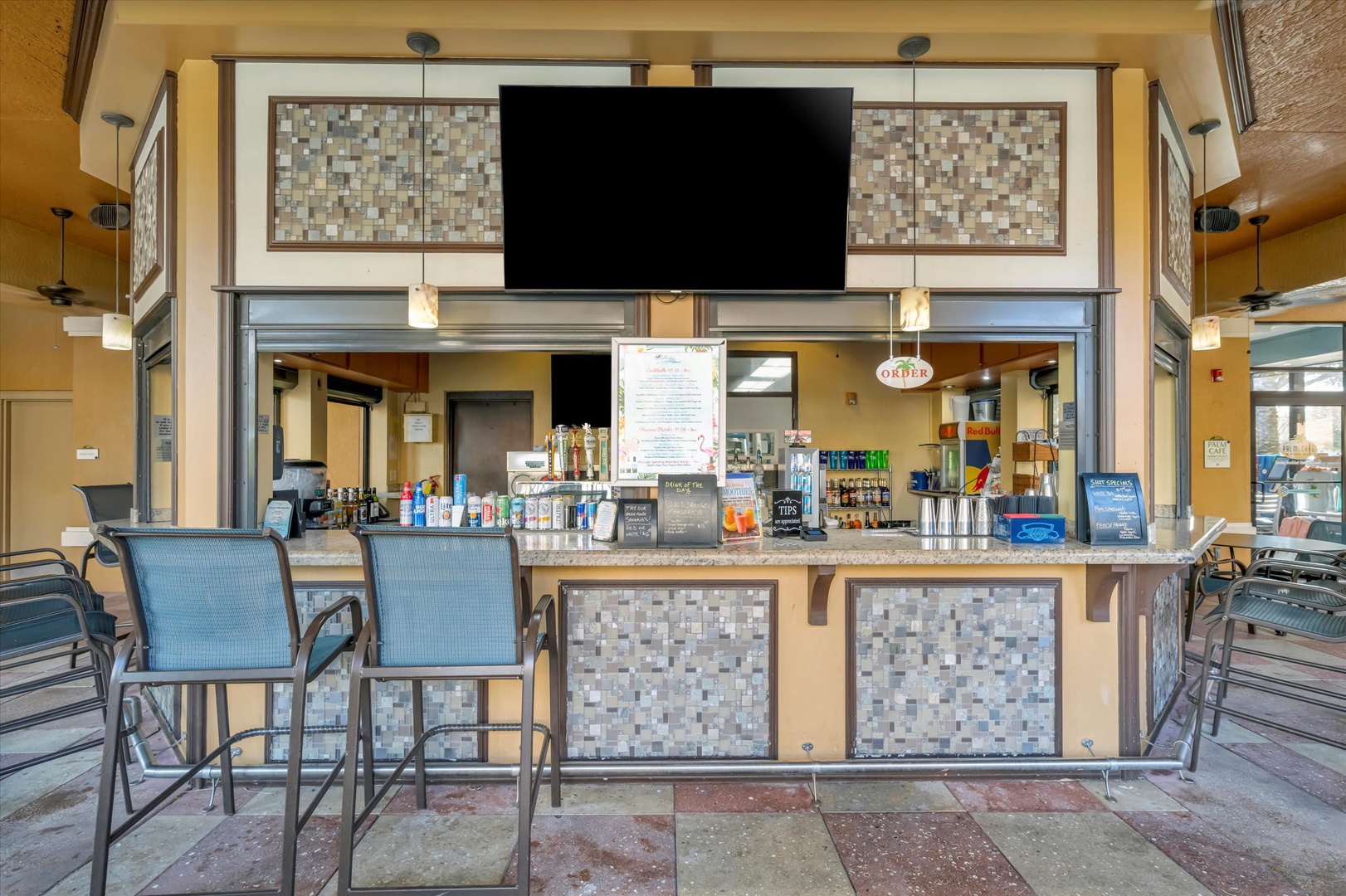 Settle into a seat at this welcoming poolside bar, where refreshing drinks and quick bites are just moments away from your next swim.