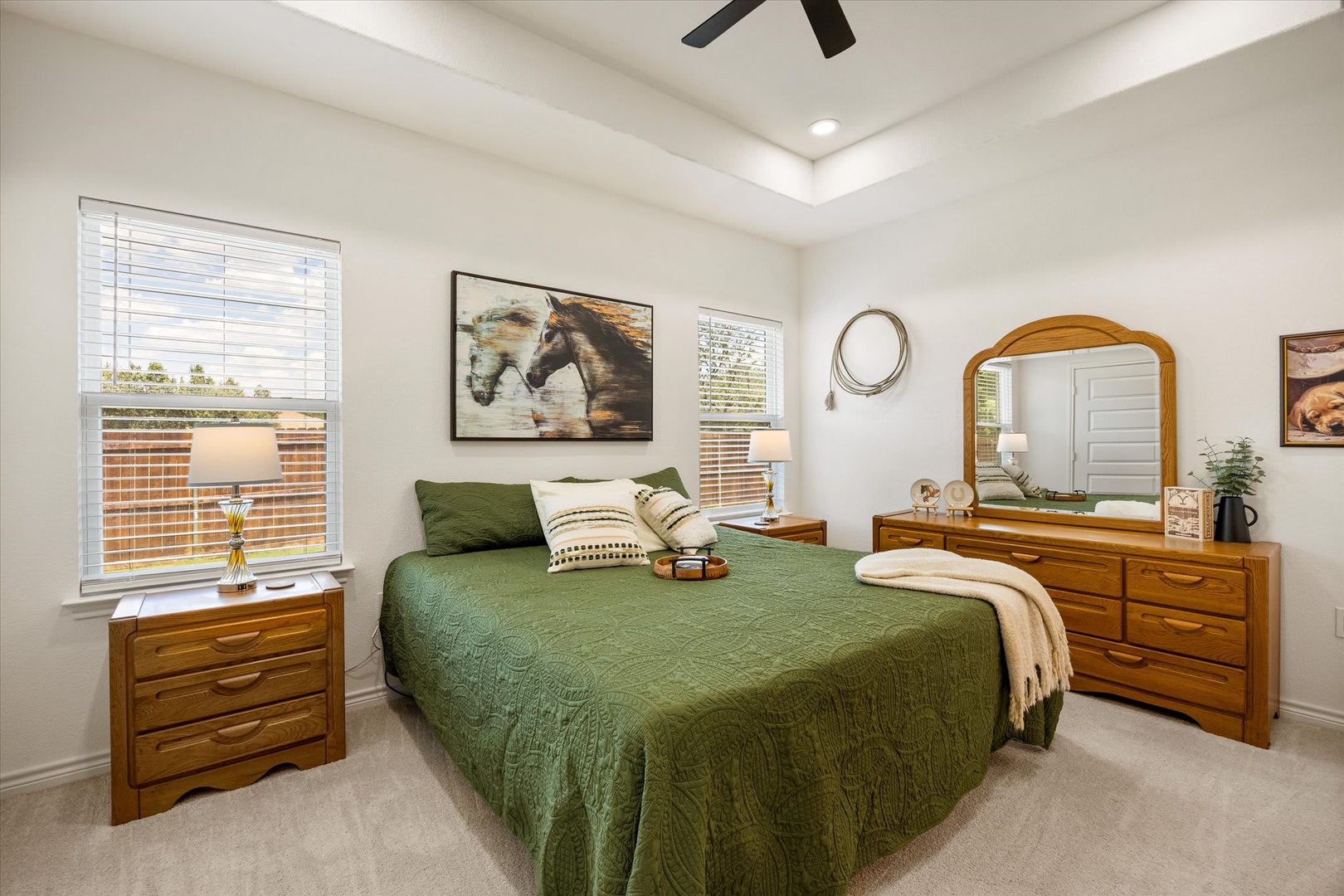 Sink into your cozy retreat, where warm wood furnishings and soft green linens invite peaceful rest. Natural light fills the space, making you feel right at home.