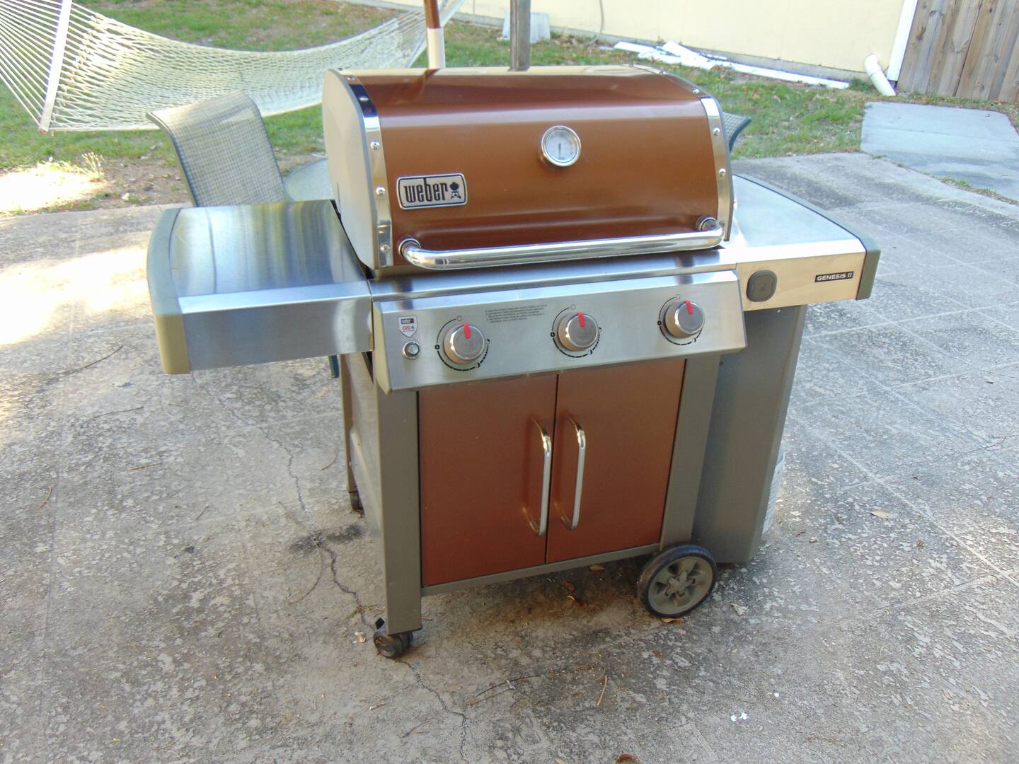 Fire up the premium Weber gas grill on your private patio and enjoy outdoor meals in a relaxed backyard setting with a hammock nearby.