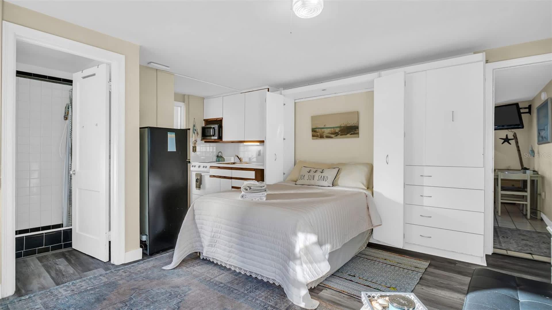 Settle into your thoughtfully designed studio, where a plush bed awaits beneath soft natural light. Smart storage solutions and a full kitchen let you feel right at home from the moment you arrive.