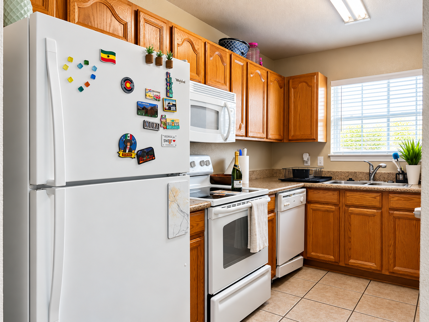 Your fully equipped kitchen makes meal prep a breeze, with modern appliances and plenty of counter space bathed in warm natural light from the window above the sink.