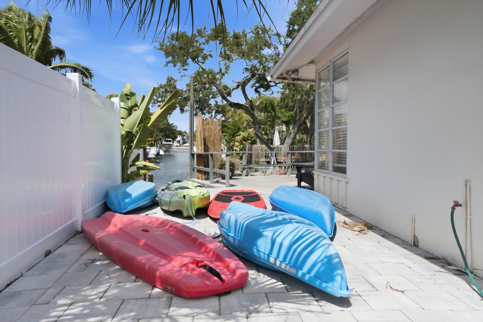 Colorful kayaks await your next waterfront adventure—step outside and explore calm canals from your private launch area.