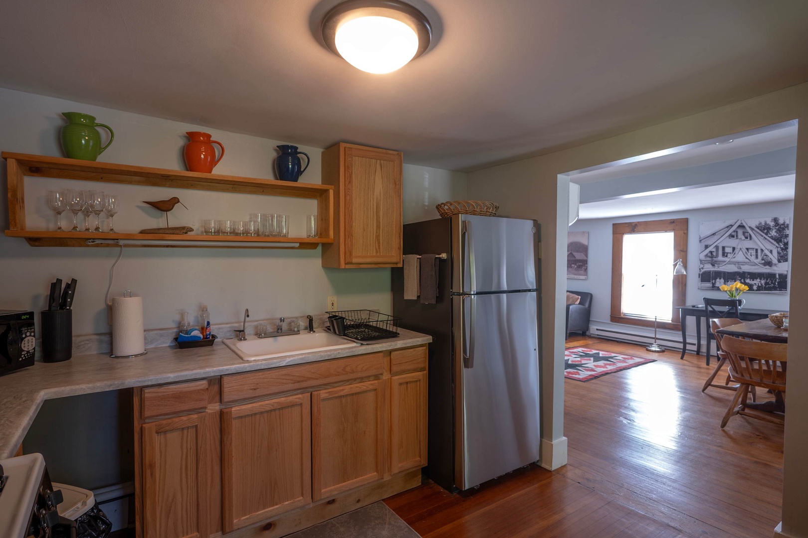 Step into your fully equipped kitchen with stainless steel appliances, warm wood cabinetry, and all the essentials for preparing your favorite meals during your stay.
