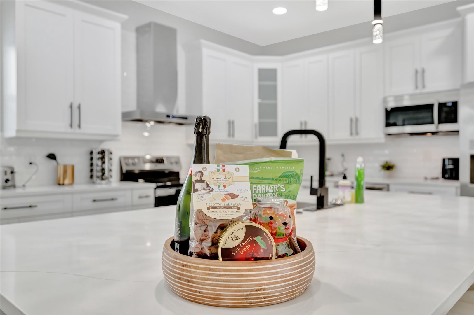 Your bright, fully-equipped kitchen welcomes you with sparkling white counters and modern appliances—perfect for whipping up breakfast or evening cocktails in style.