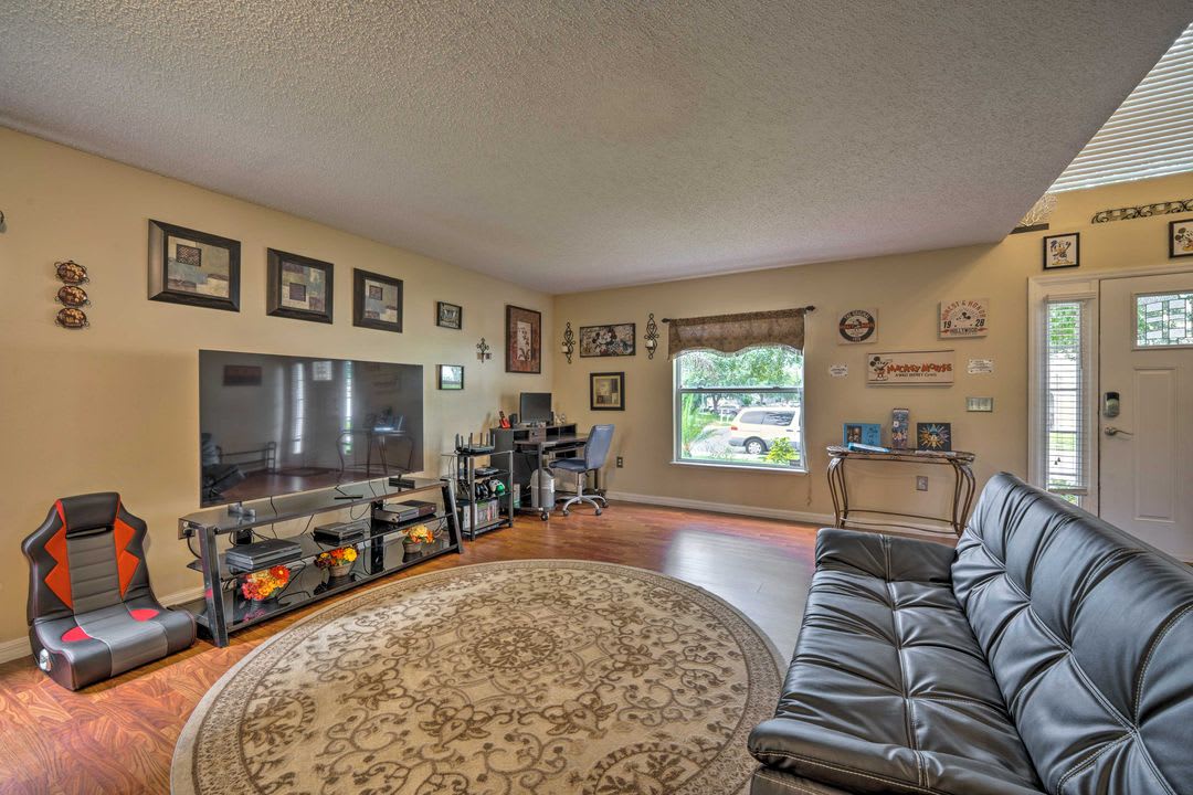 Settle into the plush leather sofa and unwind in this bright, open living space—perfect for movie nights, lively conversations, or simply relaxing with your favorite book after a day exploring the area.