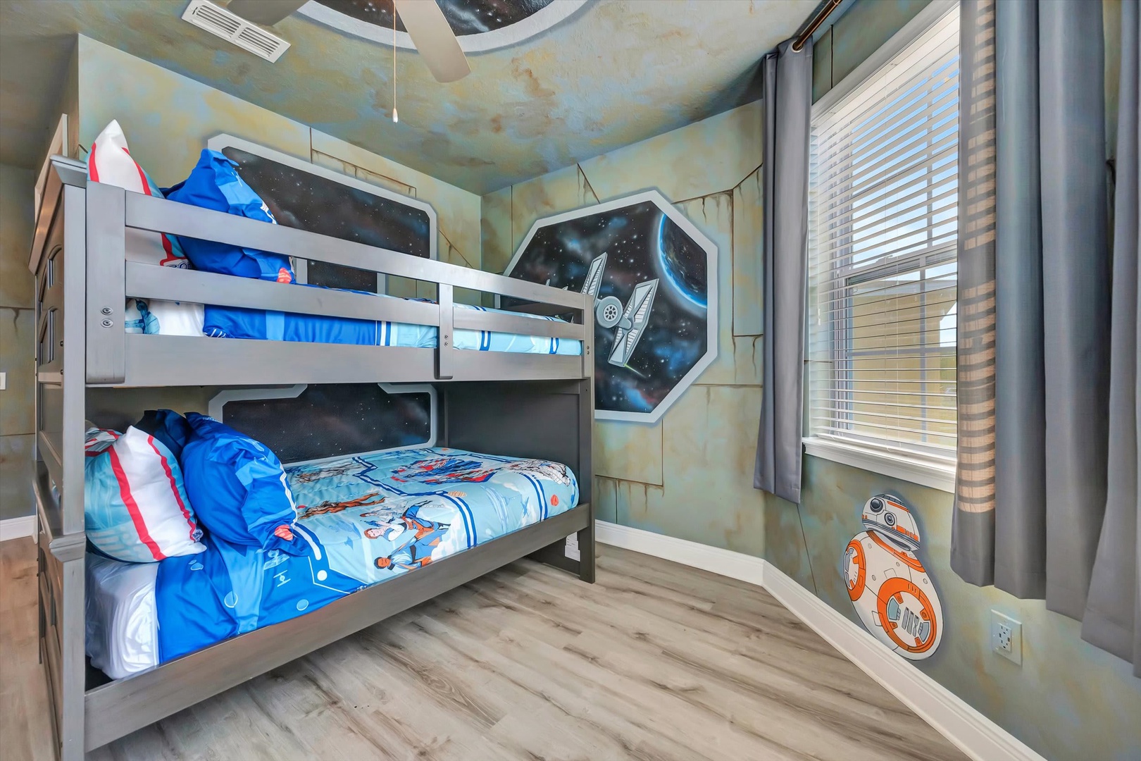Your little ones will drift off to sleep in this galaxy-themed room, complete with starlit ceiling panels and a friendly droid companion waiting by the window.
