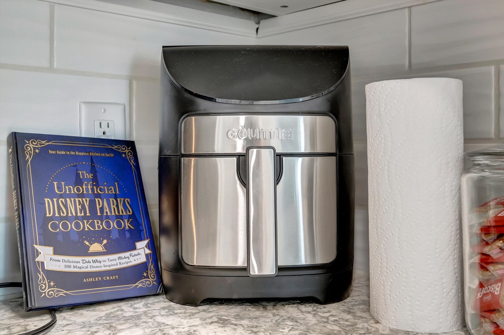 Your morning routine is made easy with a sleek espresso maker right on the counter, ready to brew your perfect cup whenever inspiration strikes.