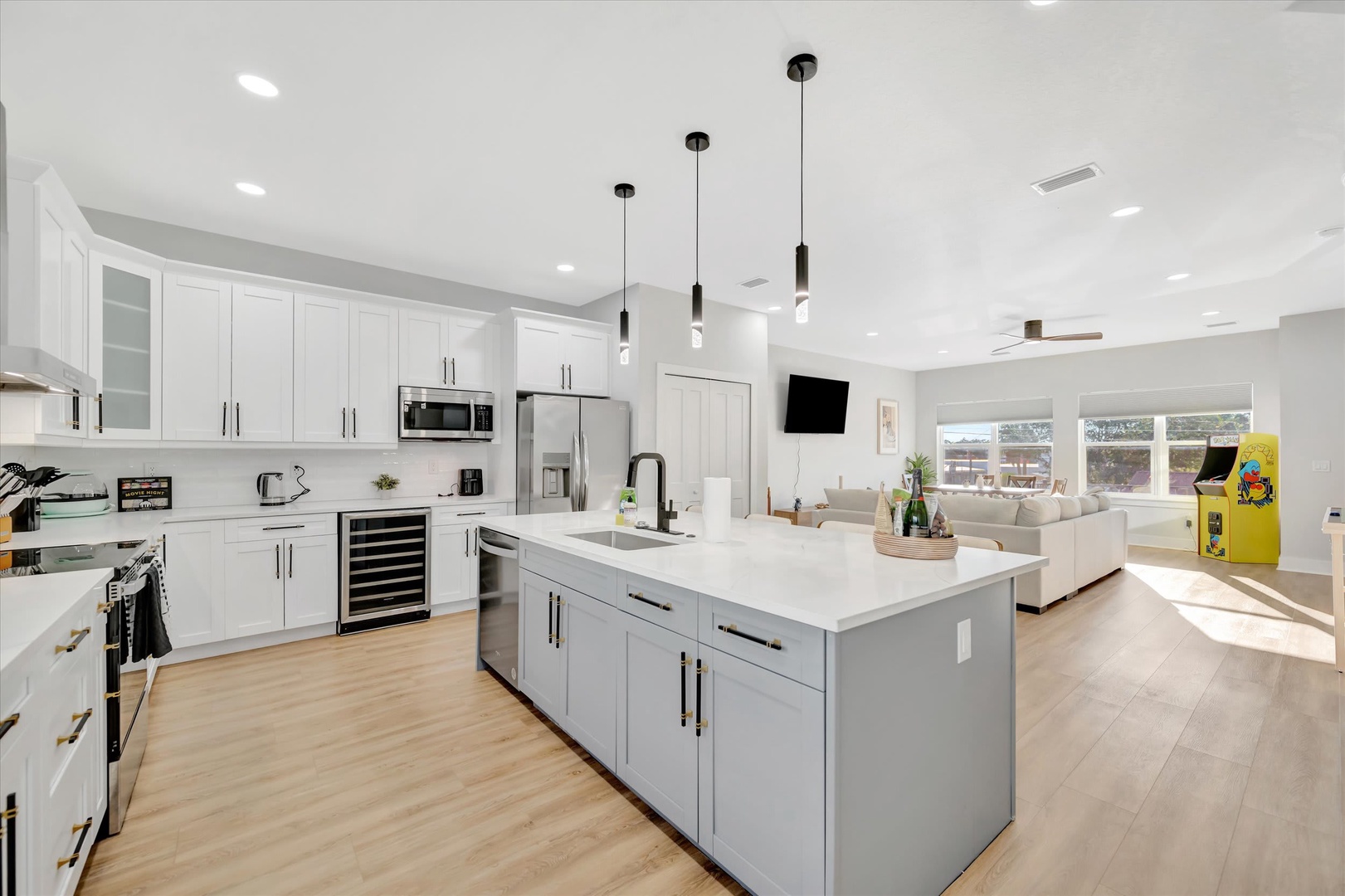 Step into your bright, open-concept living space where a sleek chef's kitchen flows seamlessly into a sunlit lounge. Cook, gather, and relax—all in one beautifully designed retreat.