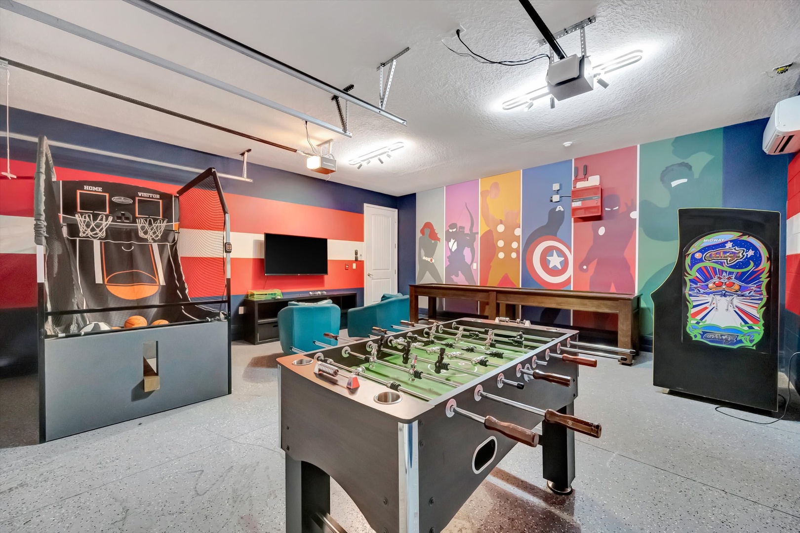 Challenge your friends to foosball, shoot hoops at the mini arcade basketball game, or relax in front of the TV—this vibrant game room offers endless fun for your group.