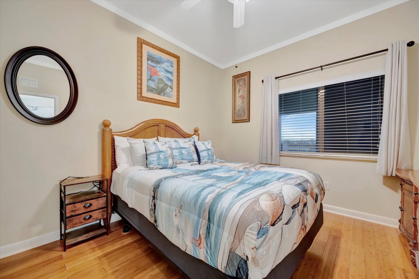 Slip into this cozy bedroom where coastal charm meets comfort. Warm wood floors and soft linens create the perfect retreat after your day of adventure.