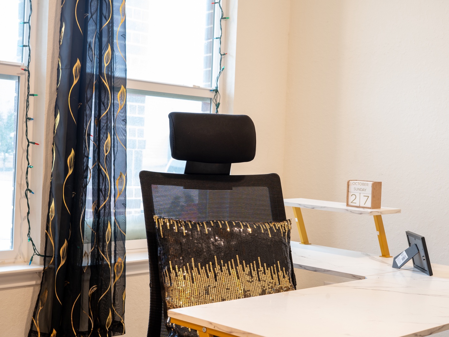 Settle into your workspace with a supportive ergonomic chair and natural light streaming through your window, creating the perfect environment for remote work or vacation planning.