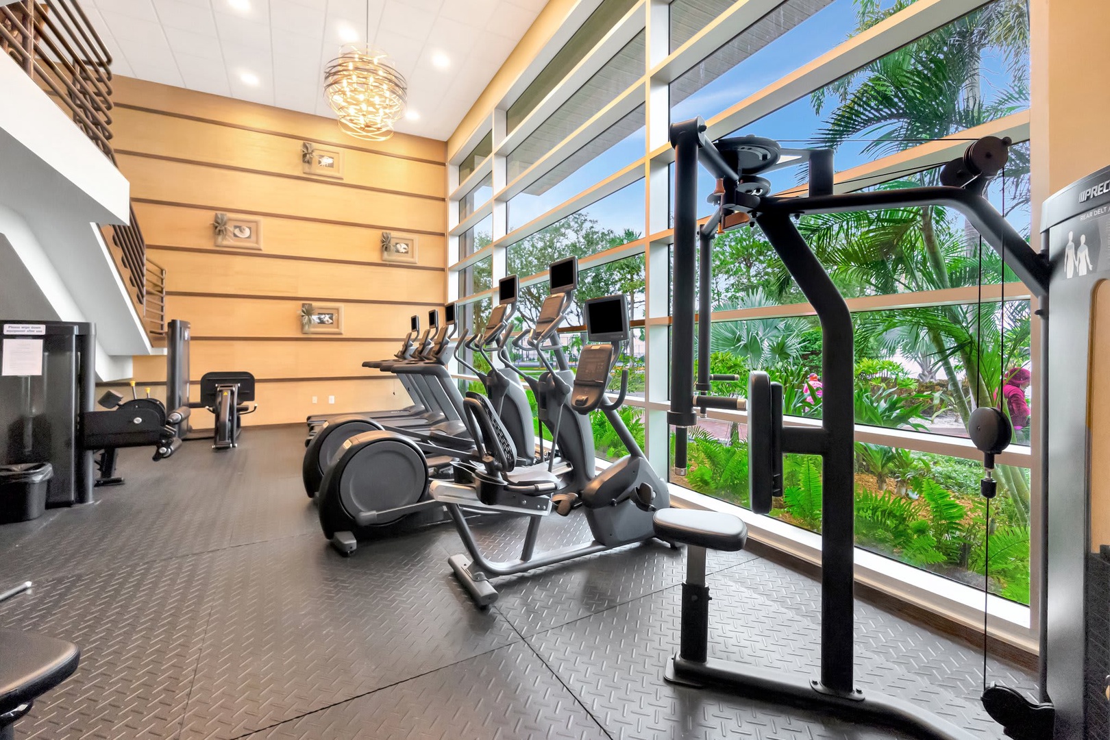Stay active in your fully-equipped fitness center, where floor-to-ceiling windows frame lush tropical gardens and let natural light energize your workout.