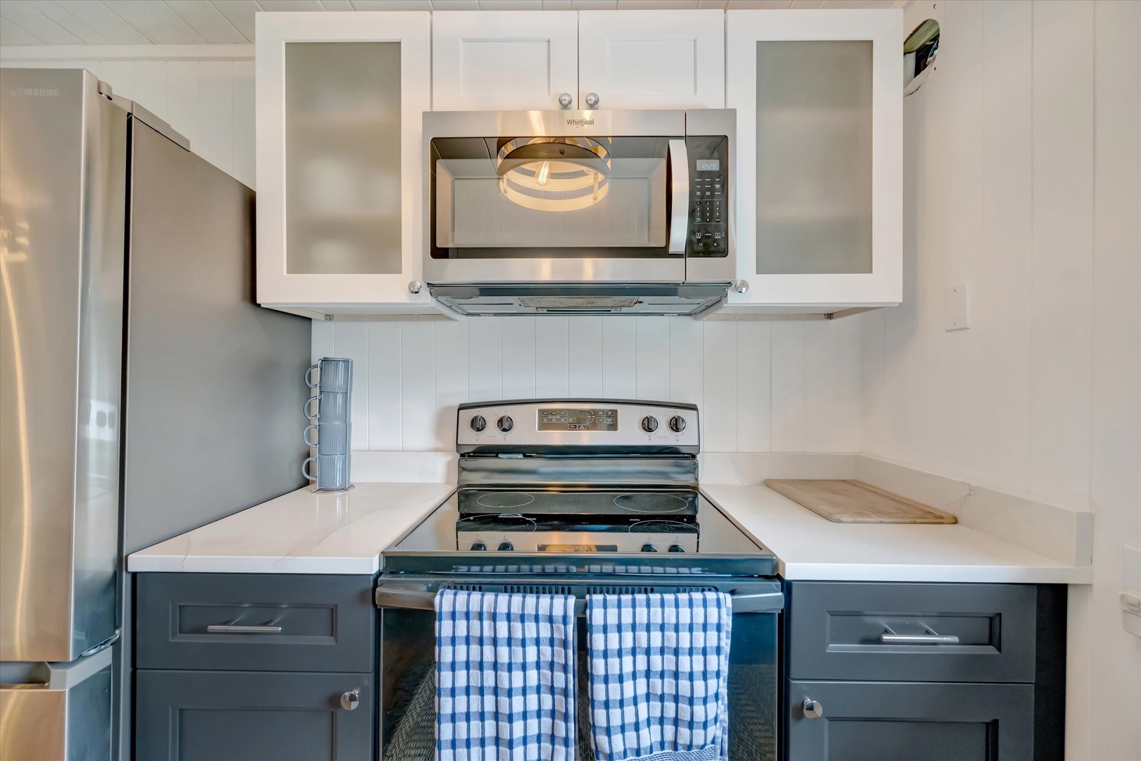 Your full kitchen awaits, featuring modern stainless steel appliances, ample counter space, and everything you need to prepare delicious home-cooked meals during your stay.