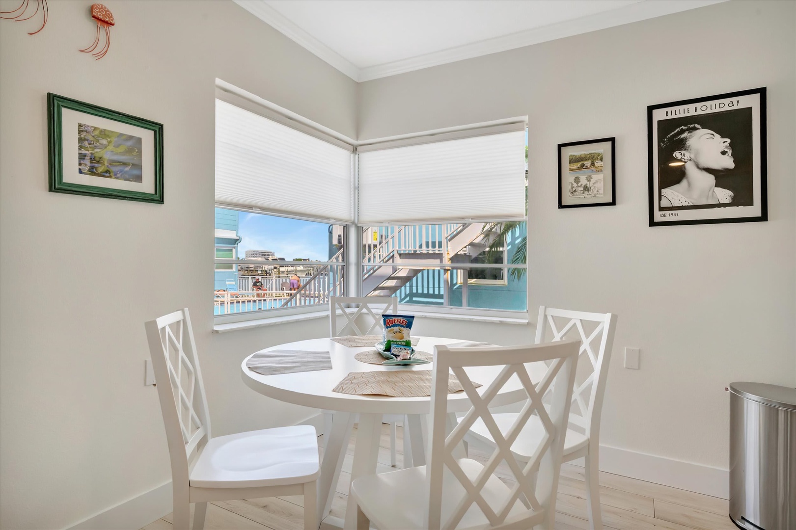 Settle in at your private dining nook where bright windows frame refreshing water views. Enjoy your morning coffee or an afternoon snack at this cozy corner table that's perfect for quiet moments together.