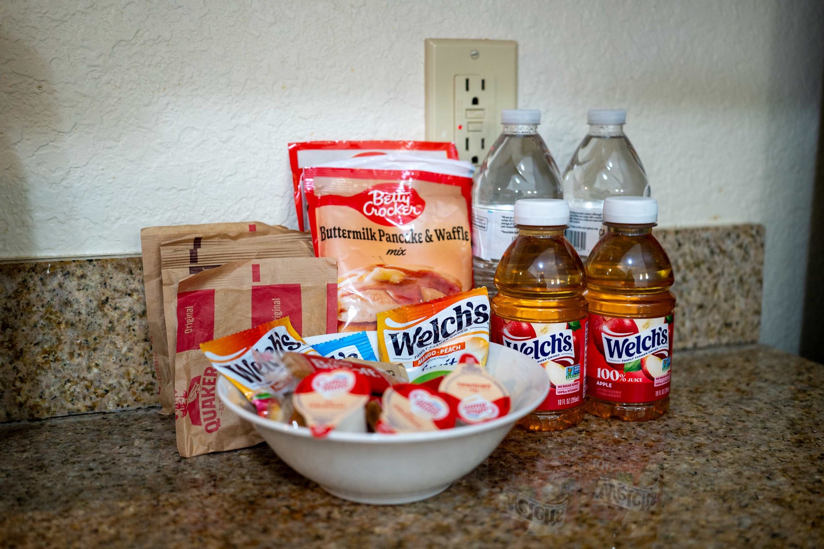 Start your mornings right with complimentary breakfast essentials stocked in your kitchen—pancake mix, fruit snacks, juice, and more await your arrival.