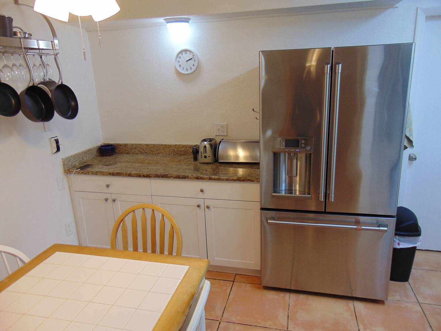 Cook your favorite meals in this well-equipped kitchen with stainless steel appliances, granite countertops, and everything you need to feel right at home.
