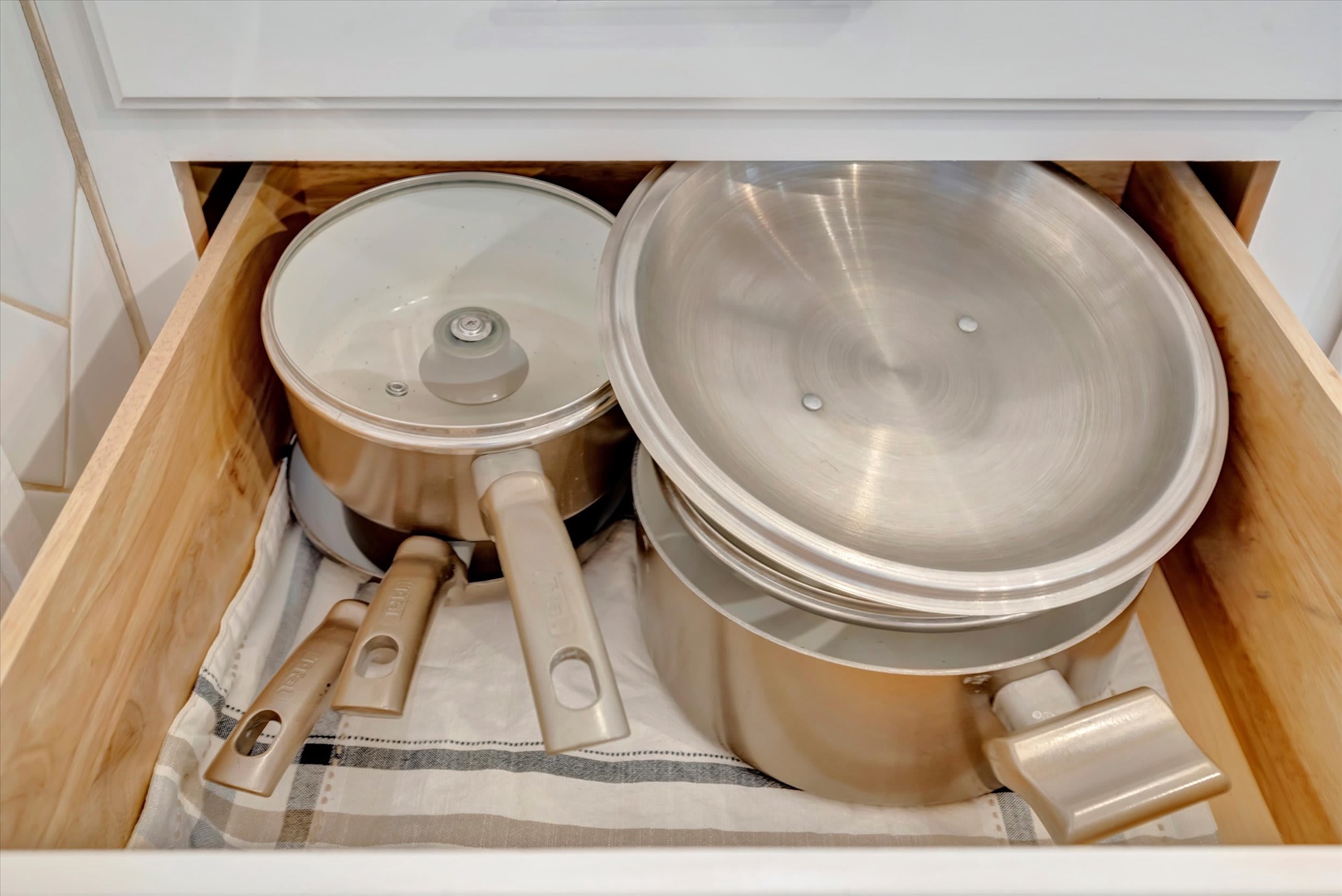 Your kitchen drawer is stocked with quality cookware, ready for home-cooked meals during your stay.