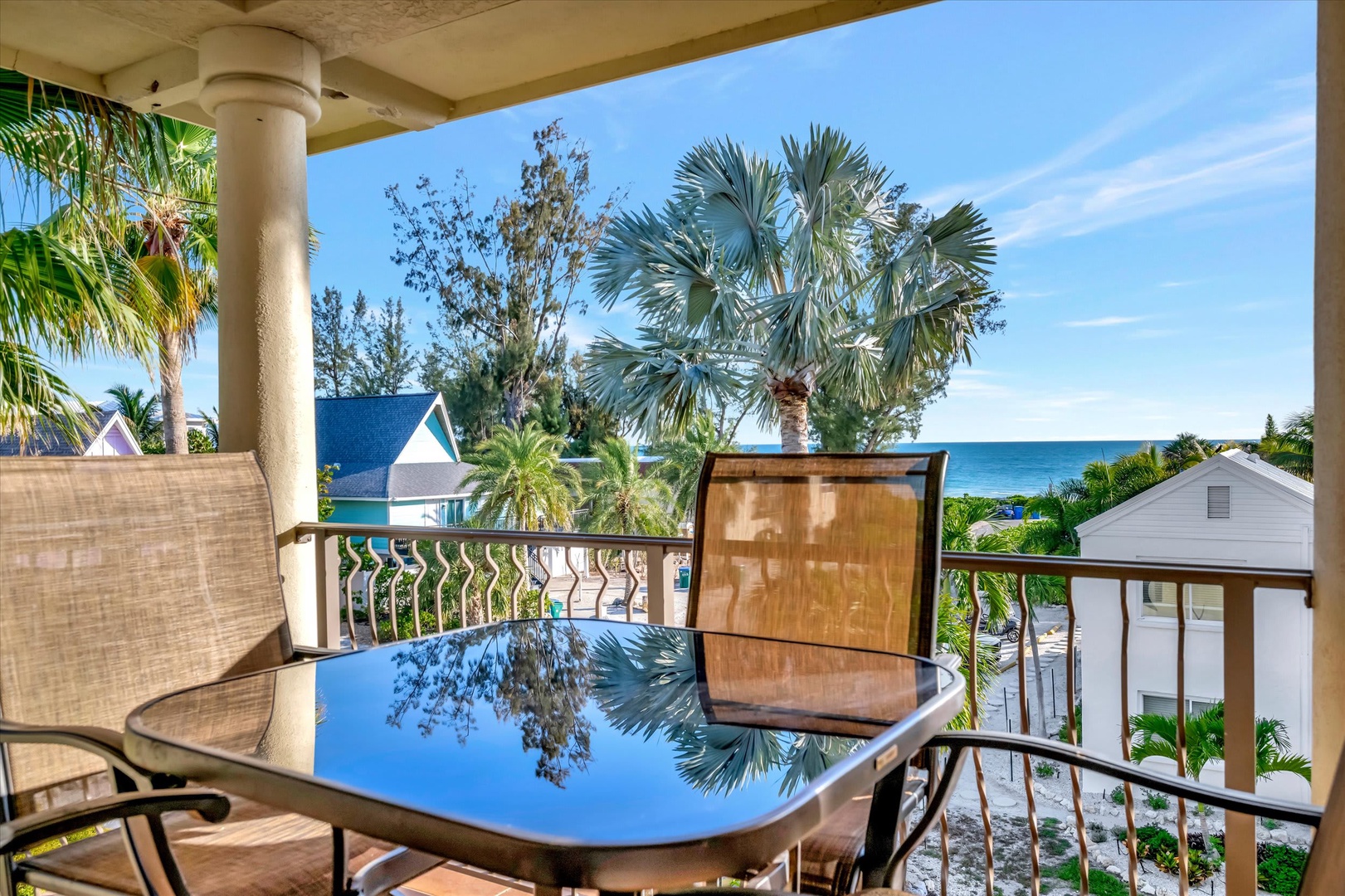 Step out onto your private balcony and take in the stunning ocean view framed by swaying palms and tropical greenery, perfect for morning coffee or sunset cocktails.