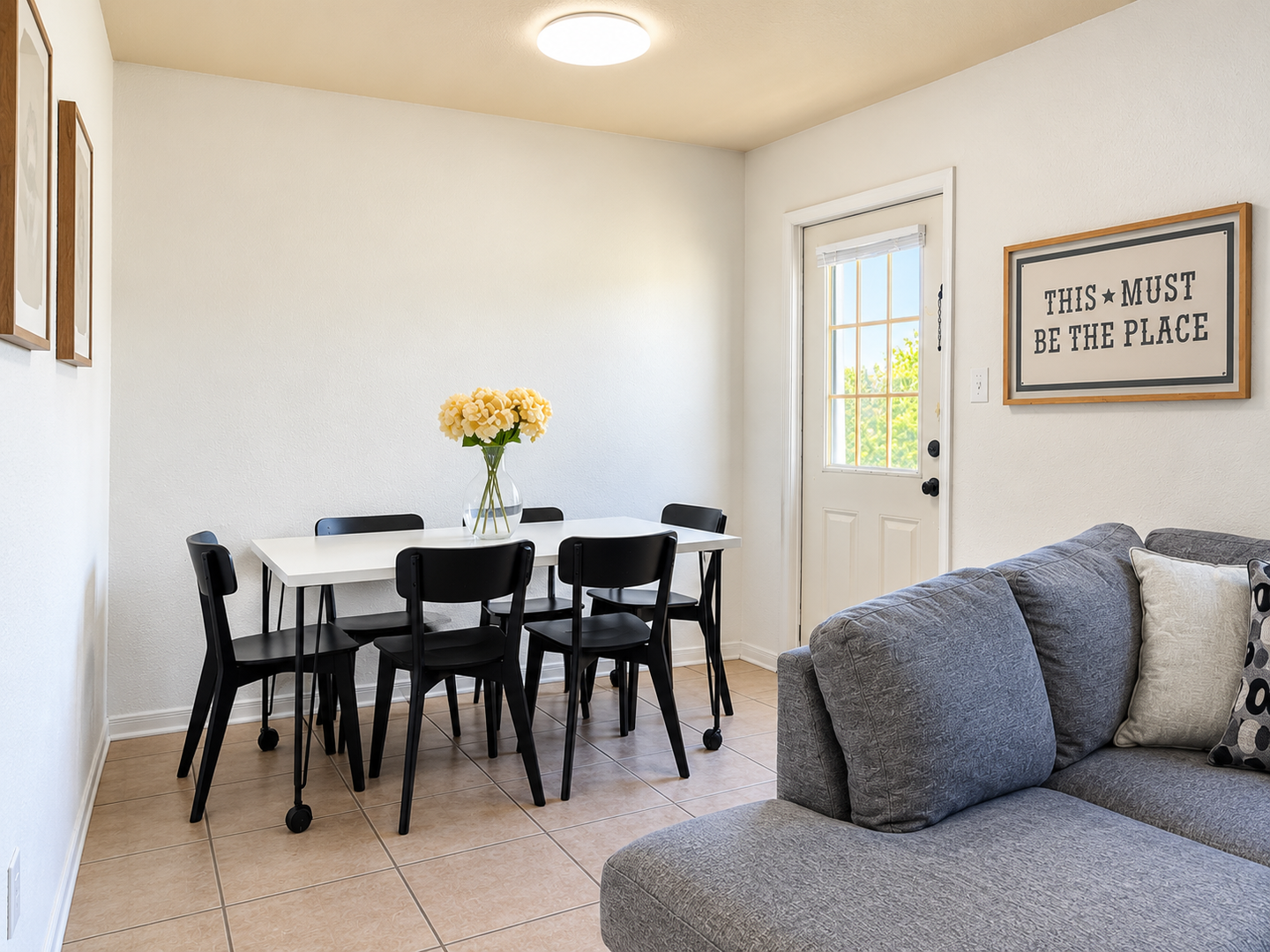 Your bright, welcoming space features a dining table for shared meals and a cozy sofa for relaxed evenings—everything you need to feel right at home.