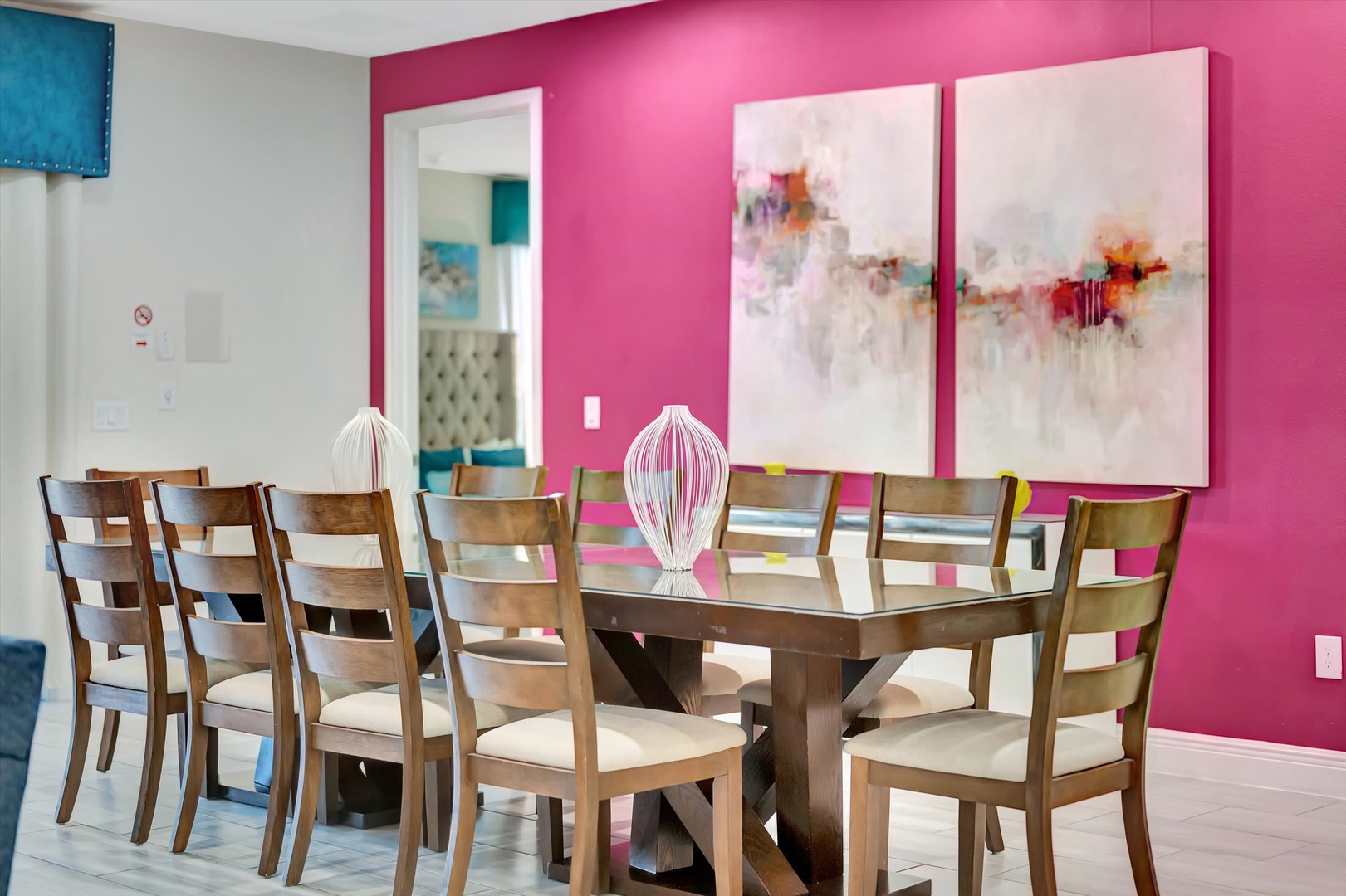 Gather around this vibrant dining space where bold color and artistic flair set the stage for your memorable meals together.
