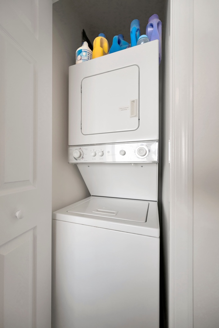 Laundry day is easy with your own in-unit washer and dryer, complete with storage space for all your supplies right above.